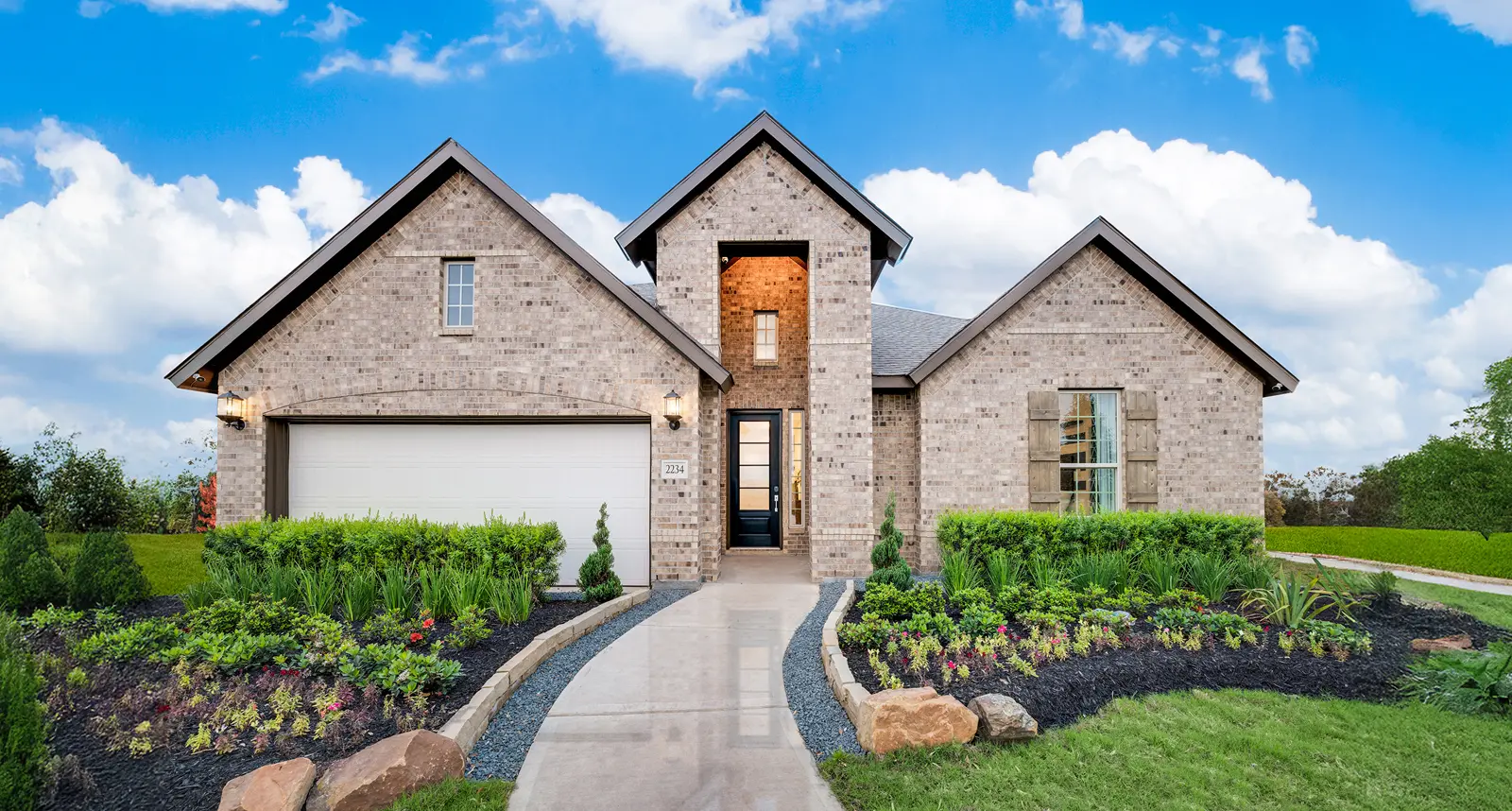 Single-story brick house in Grand Magnolia with landscaped yard, near Waller ISD schools.